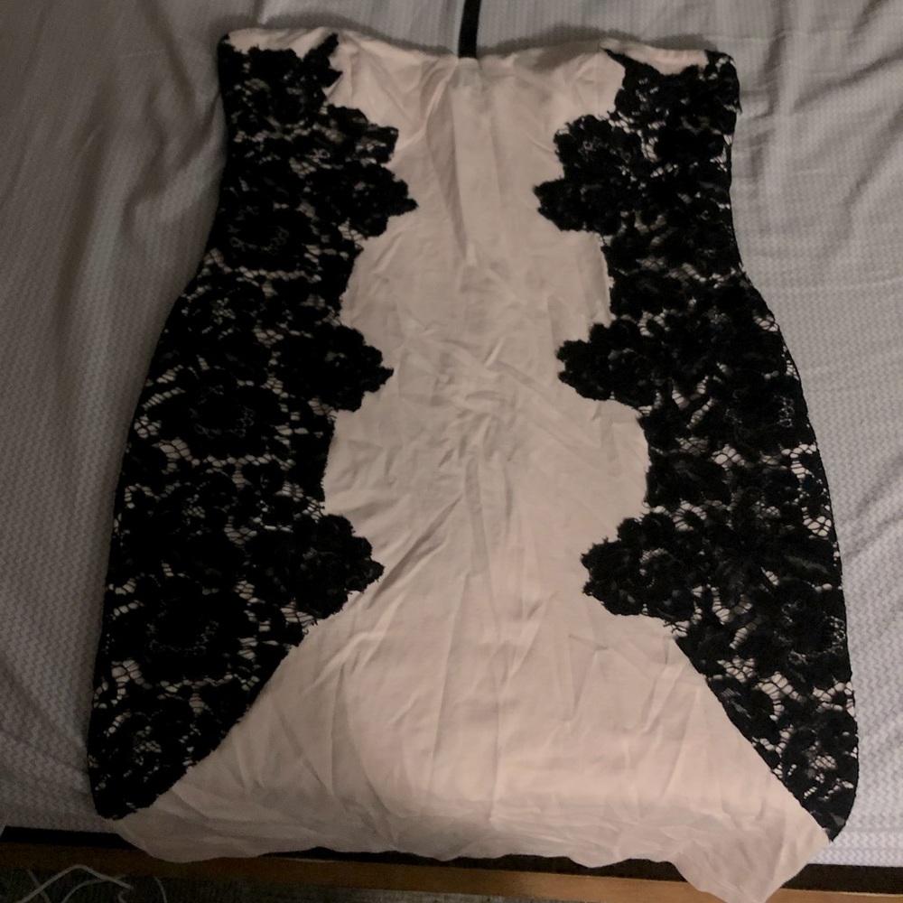 Fitted, knee length dress.